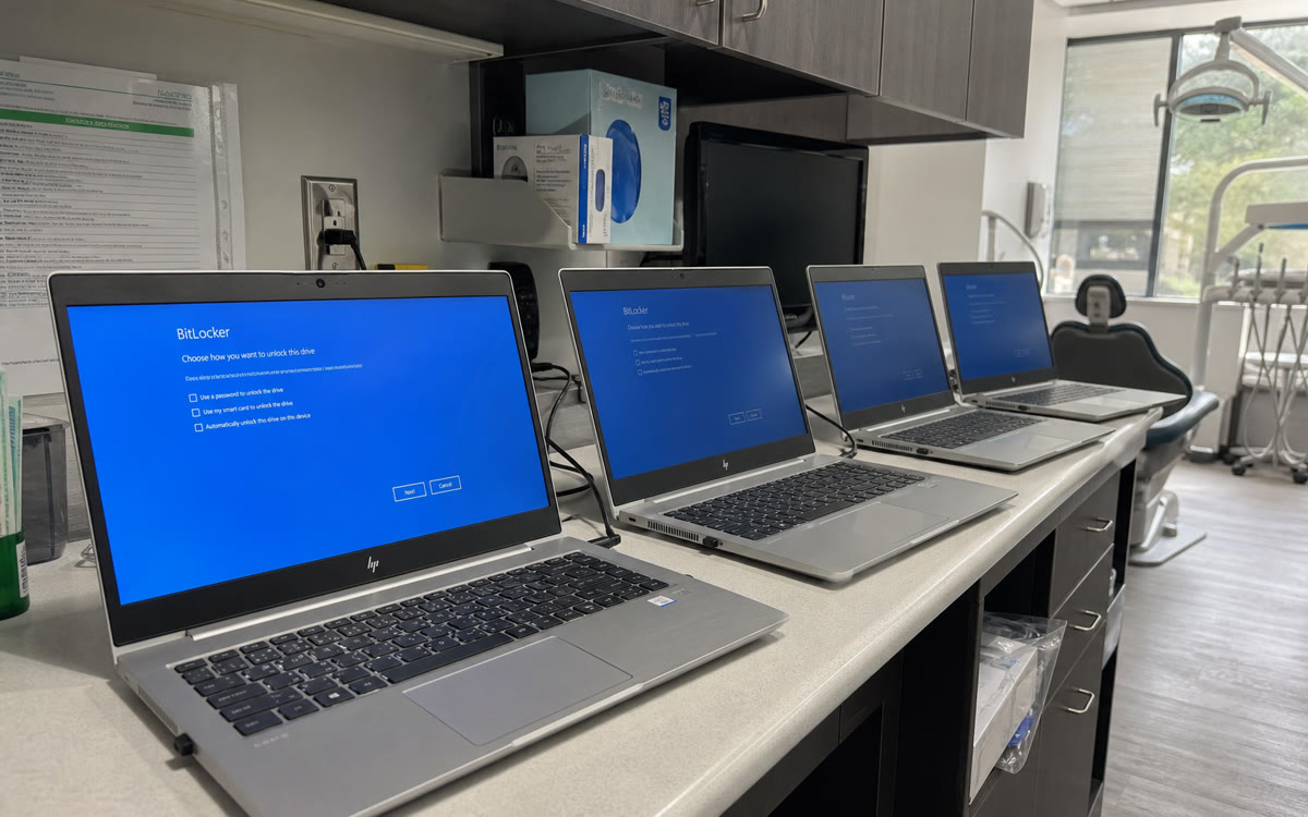 Encrypted healthcare workstations with endpoint management in a small clinic.